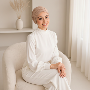 Beige turban cap — above angle, window light, smiling